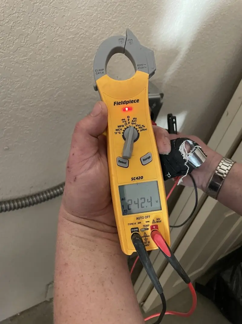 Voltage testing with clamp meter during Outlet Installation in Provo